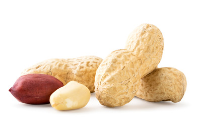 Peanuts in a shell and peeled close-up on a white. Isolated