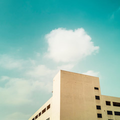 Simple building with blue sky and clouds