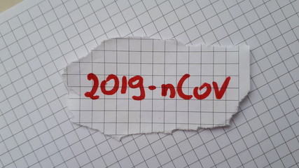 Coronavirus (2019-nCoV) lettering on the sheet of paper. Coronavirus (2019-nCoV), MERS-Cov (middle East respiratory syndrome coronavirus). Pandemic virus. Chinese, Wuhan.