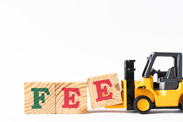 Toy forklift hold wood letter block e to complete word fee on white background