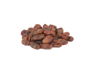 pile of dried black raisins on white background
