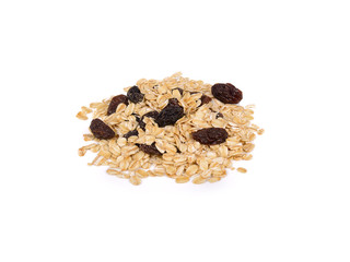pile of dried black raisins and oatmeal on white background