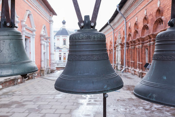 Obraz premium Old metal bells in the courtyard of the monastery