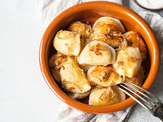Traditional Polish dish - pierogi or dumplings or vareniki potatoes and mushrooms