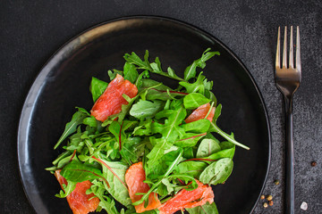 healthy salad leaves mix, salmon or tuna (delicious snack) menu concept. food background. top view. copy space