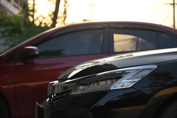 closeup headlight led of black modern car in the morning scene