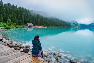Girl enjoying the view of Lake Louise, Banff, Canada