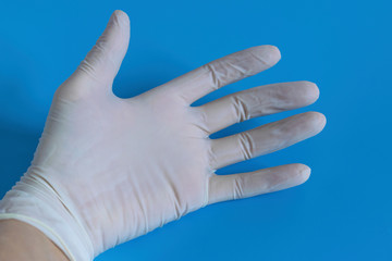 White disposable gloves. Hygiene and protection against diseases and viruses. Coronavirus