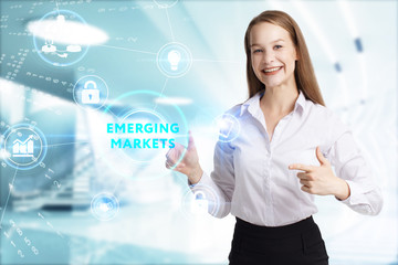 Business, Technology, Internet and network concept. Young businessman working on a virtual screen of the future and sees the inscription: Emerging markets
