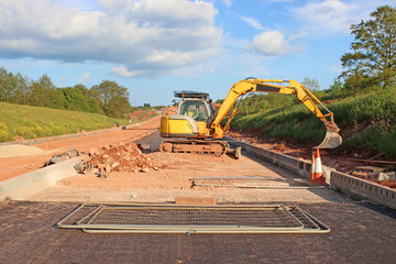 Digger on a road construction site	