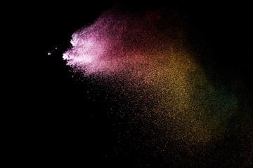 Fototapeta na wymiar Explosion of colored powder isolated on black background. Abstract colored background. holi festival.