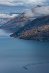 Queenstown New Zealand. Mountains. Clouds. Snow. Aerial. Lake Wakatipu