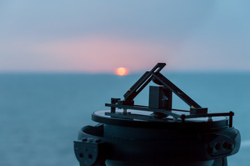 Gyro compass repeater onboard a offshore vessel navigational bridge. Montrose Scotland May 2015 © Arild
