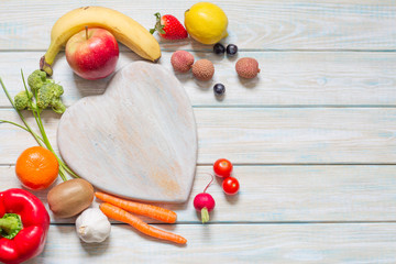 Healthy lifestyle concept diet and nutrition with fruits and vegetables on the heart abstract background