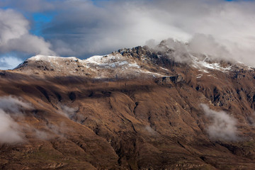 Queenstown New Zealand. Mountains. Clouds. Snow. Aerial. Lake Wakatipu