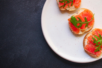 sandwich salmon smorrebrod (delicious snack seafood fish) menu concept. food background. top view. copy space