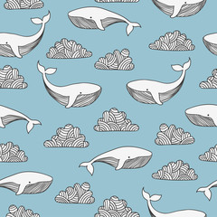 Seamless blue pattern with cute whales and clouds.