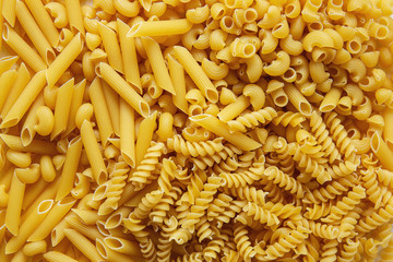 Top view Heap of various uncooked pasta