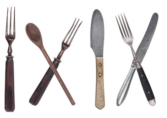 Fototapeta premium Beautiful old vintage fork and knife isolated on white background. Top view. Retro silverware