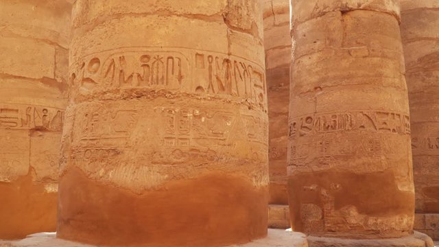 Columns with drawings in Karnak Temple in Luxor Egypt