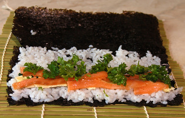 Sushi preparation, rolls before wrapping on a bamboo mat