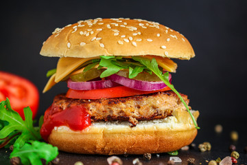 burger, meat cutlet beef steak, tomato, sauce and lettuce (tasty meat snack sandwich) menu concept. food background. top view. copy space