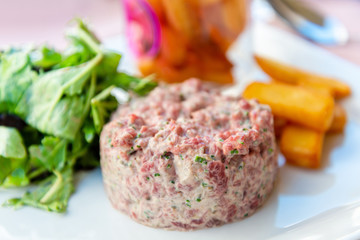 tasty Steak tartare (Raw beef) - classic steak tartare on white plate