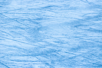 Abstract ice texture. Nature blue background. Traces of blades of skates on ice