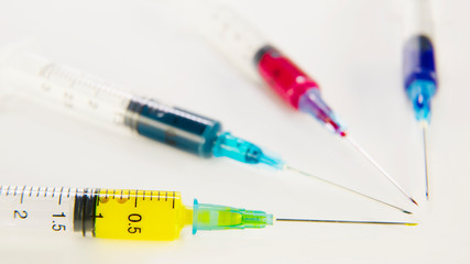 medical syringes with colored paint