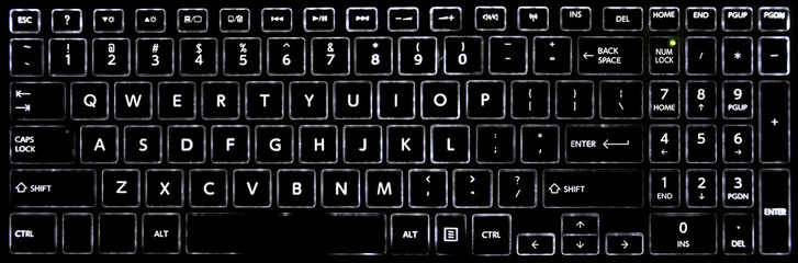 Close-up of a black laptop keyboard with LED backlit keyboard buttons.