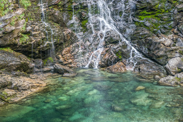 Froda waterfall in Val Verzasca with green water (switzerland)