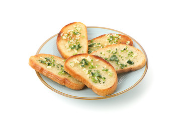 Plate of toasted bread slices with garlic isolated on white background