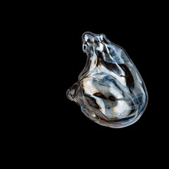 Colorful creative amorphous soap bubble floating with a black background