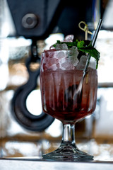 Bramble cocktail on a hook background.