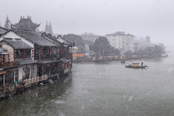 Fototapeta na wymiar Snowfall in an ancient chinese city Zhujiajiao, Shangha, China