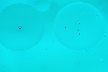 Cyan blue abstract background picture made with oil, water and soap