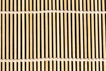 Closeup wooden bamboo straw mat for cooking sushi food asia