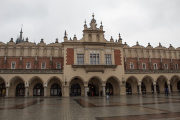 Fototapeta premium Market Square in Krakow for Catholic Christmas with the Christmas market, Rows of rows, Mariinsky Church and the Town Hall.