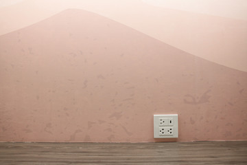 Plug Socket on the Wall with Pastel Background/Flower
