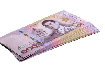 Obraz na płótnie Canvas Closeup bank 100 bath thai with white background,stack of bank 100 bath thai