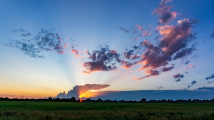 Sunset over an open field