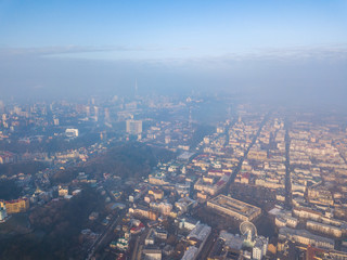 Aerial drone view. Houses in the city center of Kiev on a foggy morning.