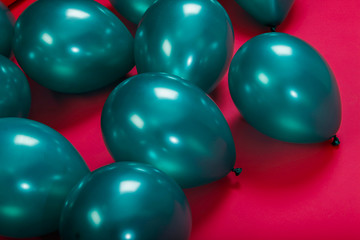 colorful green balloons on a pink background