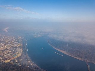 Aerial drone view. Panoramic view of the Dnieper River from the center of Kiev on a foggy morning.