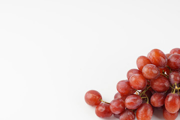 Red grape isolated over white background.