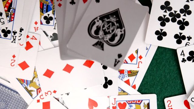 Aces Fall on Pile of Cards in Slow Motion