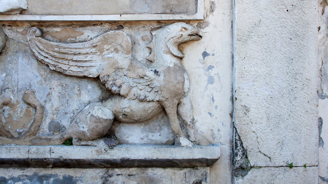 Sculptural Relief With Griffin On Grey Stone Wall