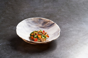 Vegetarian vegetable salad with fresh fish fillet.