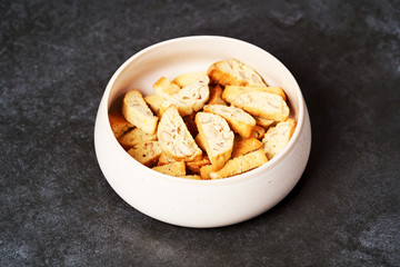 Sweet cookies with nuts on white bowl. Healthy snack