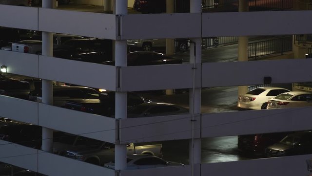 Cars in a parking garage at night